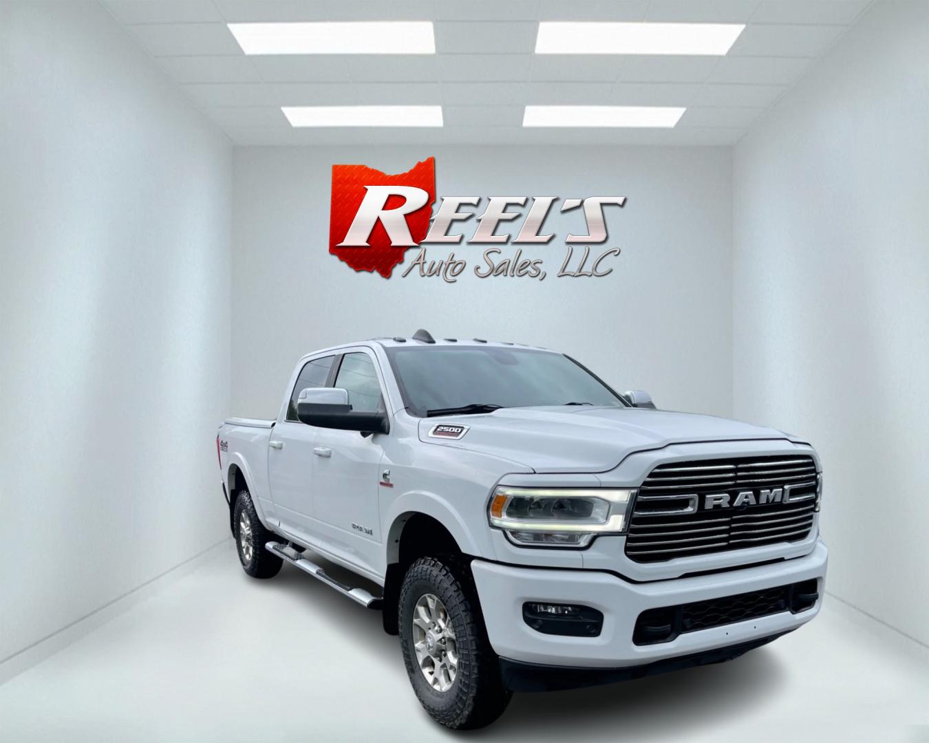 2020 White /Black RAM 2500 Laramie Crew Cab SWB 4WD (3C6UR5FL7LG) with an 6.7L I6 OHV 24V TURBO DIESEL engine, 6A transmission, located at 11115 Chardon Rd. , Chardon, OH, 44024, (440) 214-9705, 41.580246, -81.241943 - This 2020 Ram 2500 Laramie Crew Cab is a powerhouse pickup truck designed for serious towing and hauling capabilities. Under the hood lies a 6.7L Cummins Turbo Diesel engine mated to a 6-speed 68RFE transmission with 3.73 gearing, producing an impressive 370 hp and a staggering 850 lb-ft of torque. - Photo#2